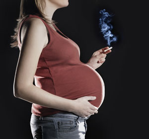 Pregnant Woman Smoking A Cigarette